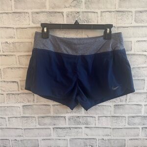 Women’s Dri-fit Nike blue with gray waistband lined athletic shorts Medium